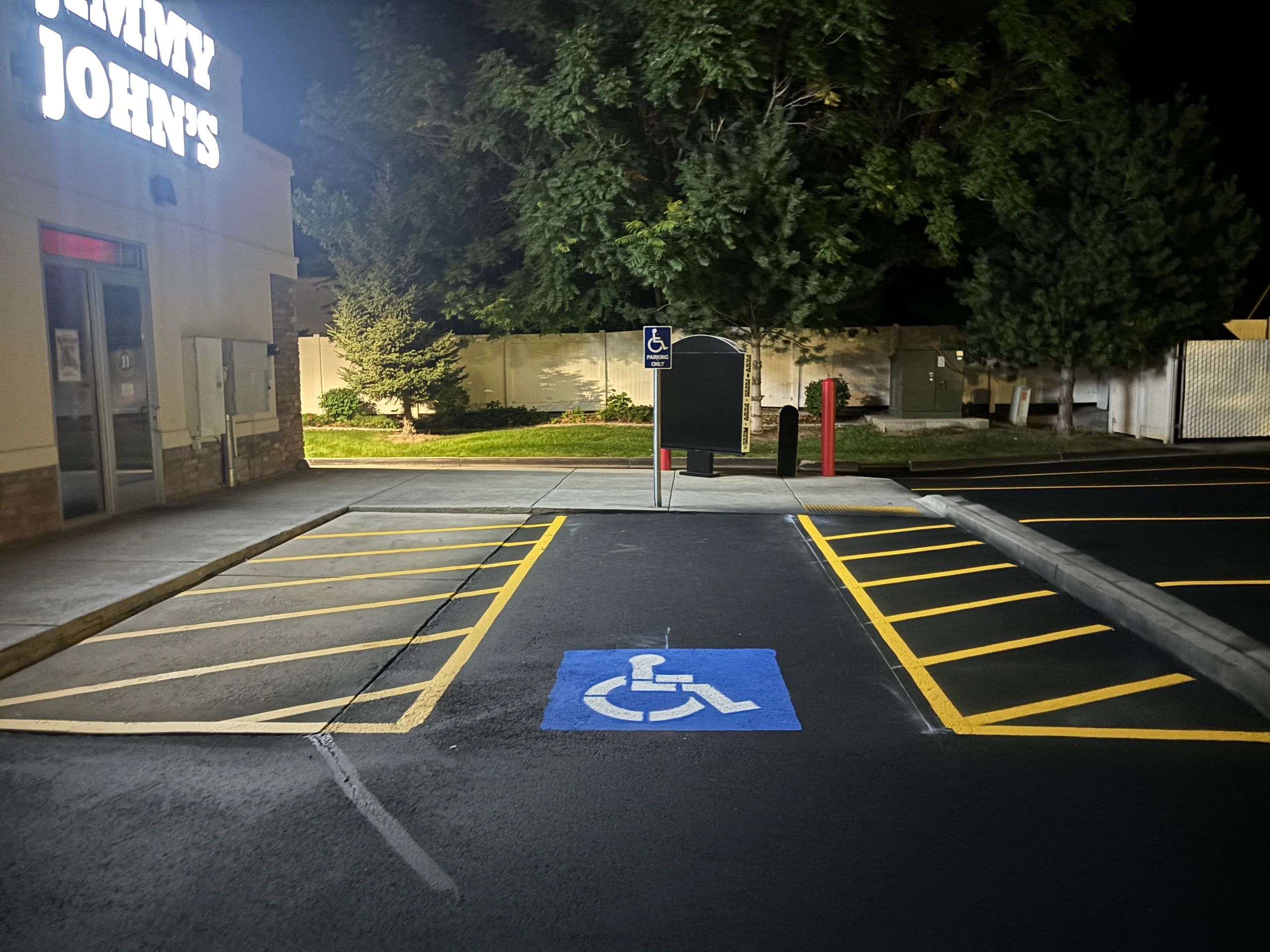 Commercial parking lot with fresh striping and handicap markings